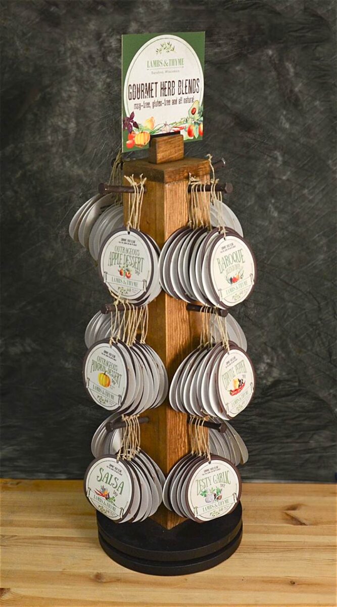 Lambs & Thyme gourmet herb blend retail store display made with rustic wood with dips displayed around and sign on top