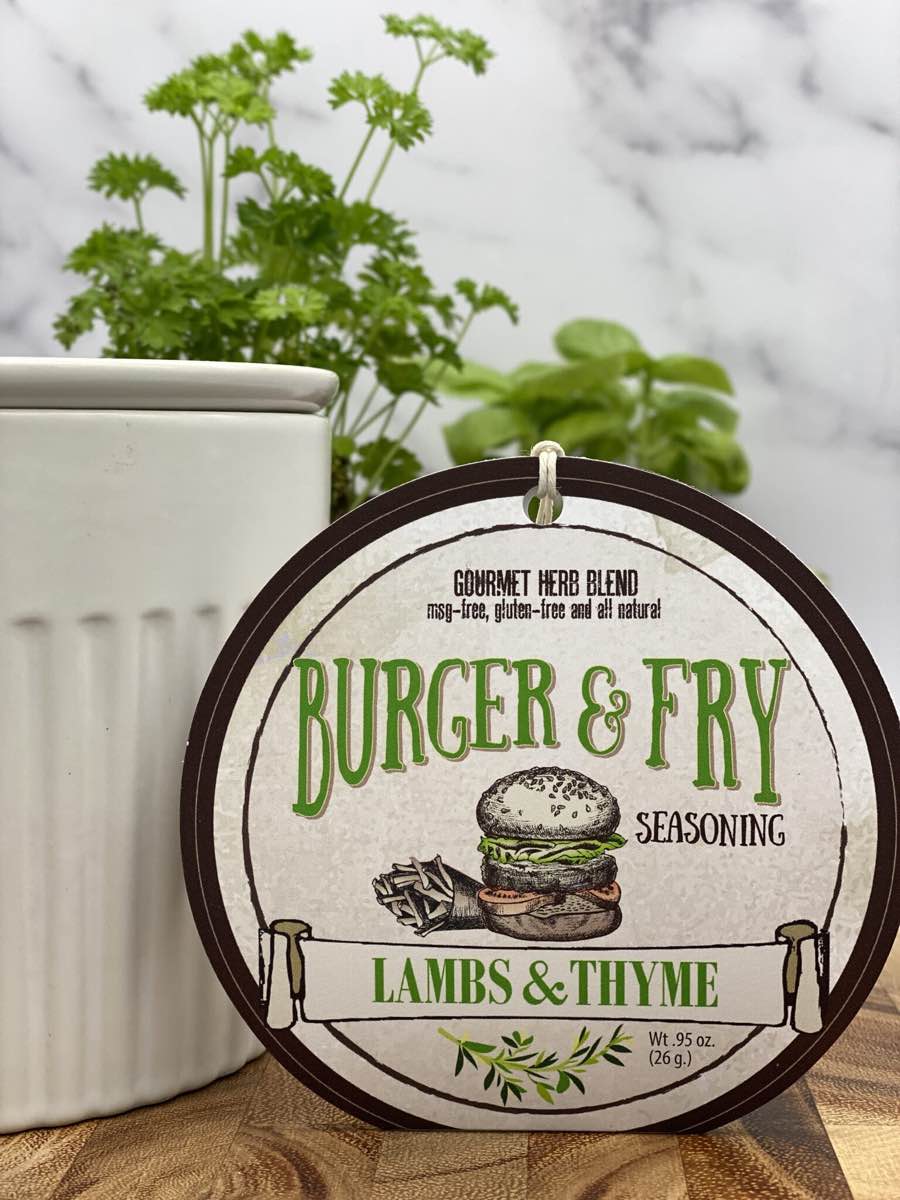 Burger & Fry Seasoning product package displayed with dip chiller on wooden cutting board
