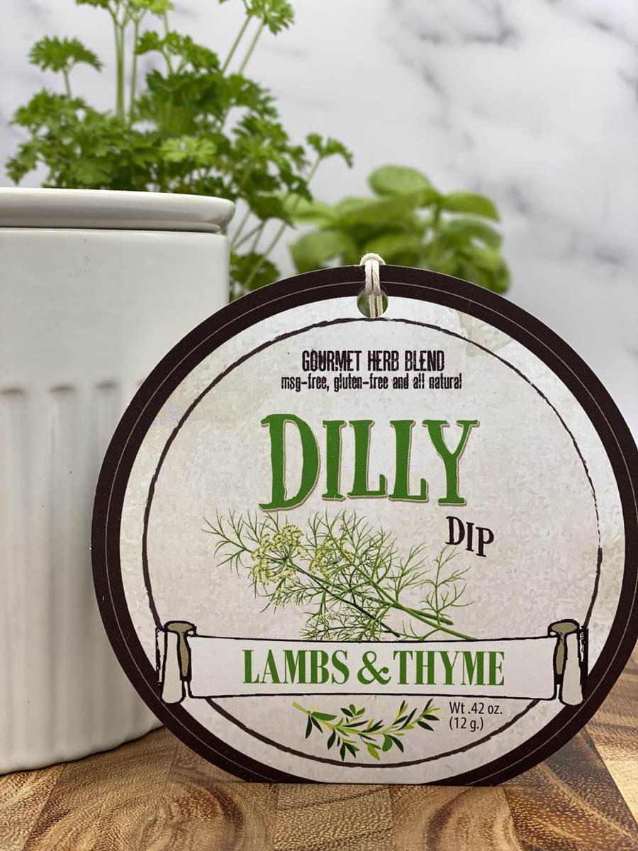 Dilly Dip product package displayed with dip chiller on wooden cutting board