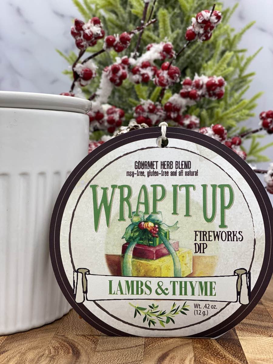 Wrap It Up Dip product package with dip chiller and holly berries on wooden cutting board