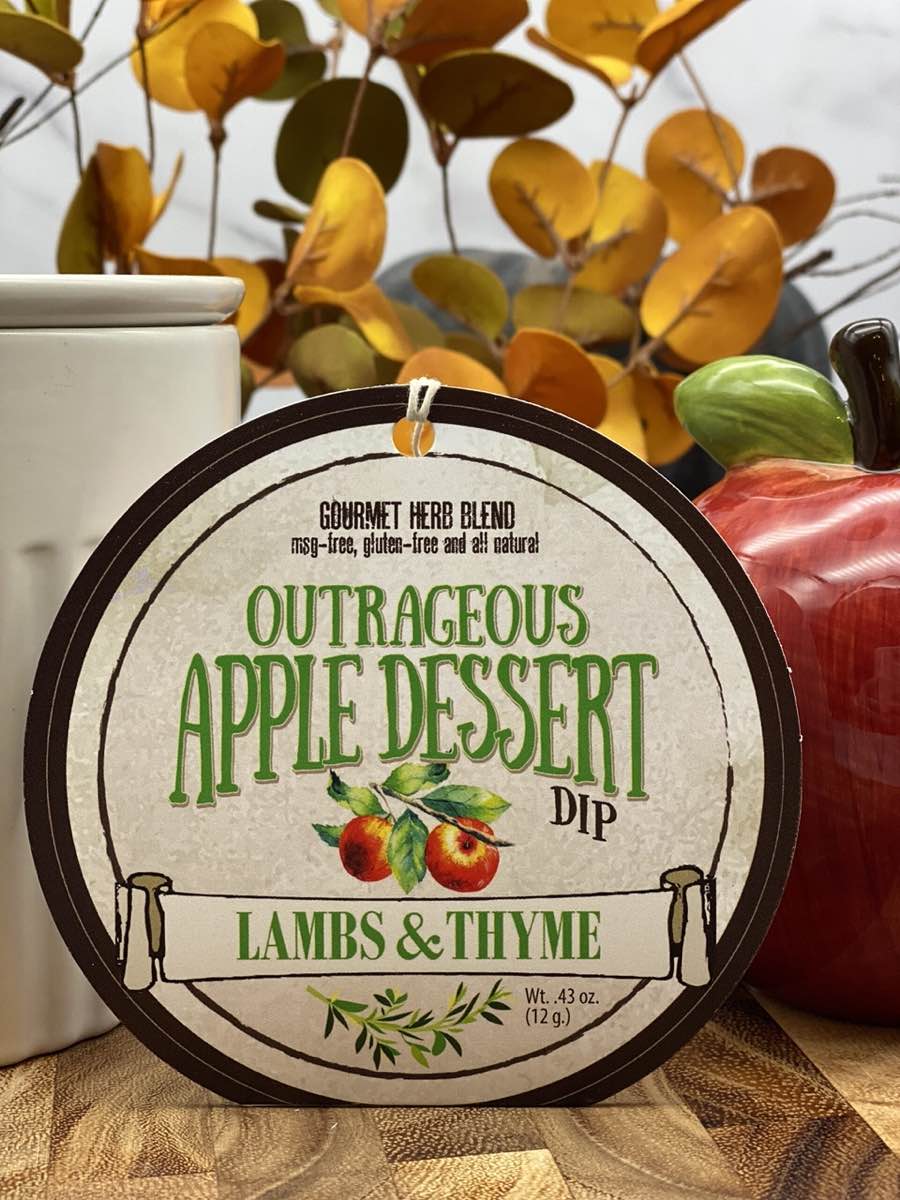Outrageous Apple Dessert Dip product package displayed with dip chiller on wooden cutting board