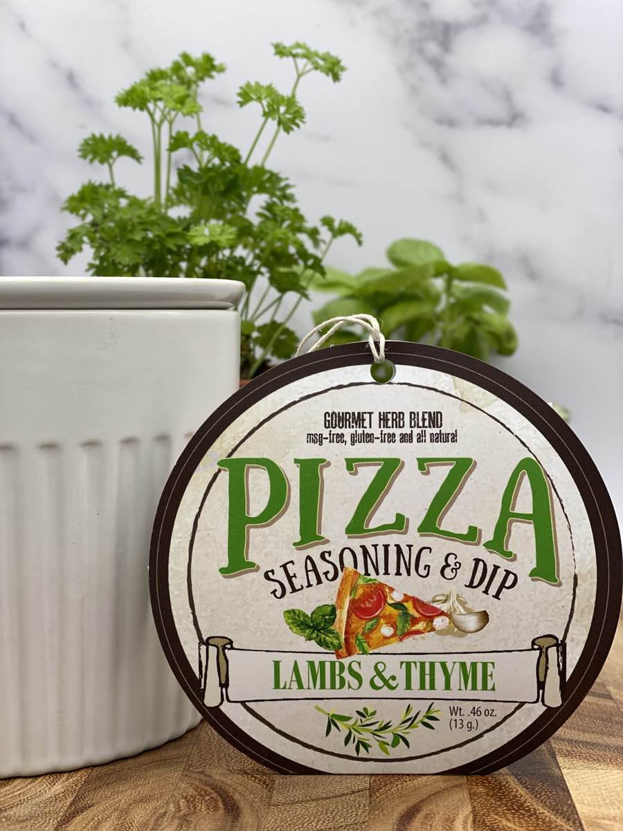 Pizza Seasoning & Dip product package displayed with dip chiller on wooden cutting board