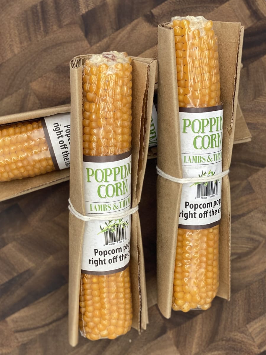 three original popping corn cobs wrapped in paper popping bags