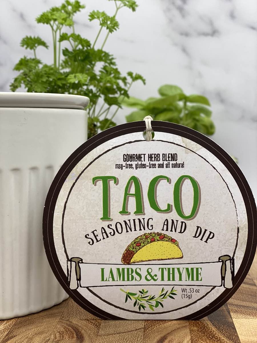Taco Seasoning & Dip product package displayed with dip chiller on wooden cutting board