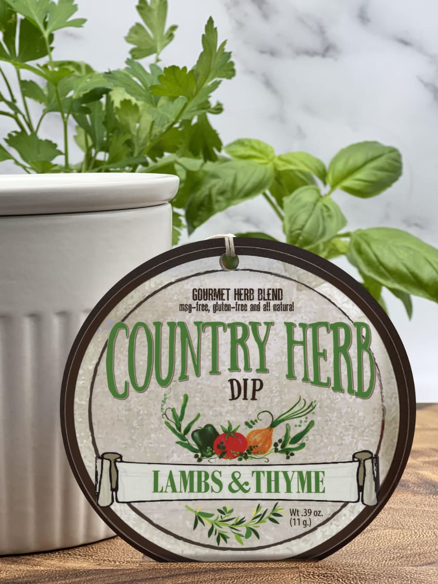 Country Herb Dip product package displayed with dip chiller on wooden cutting board